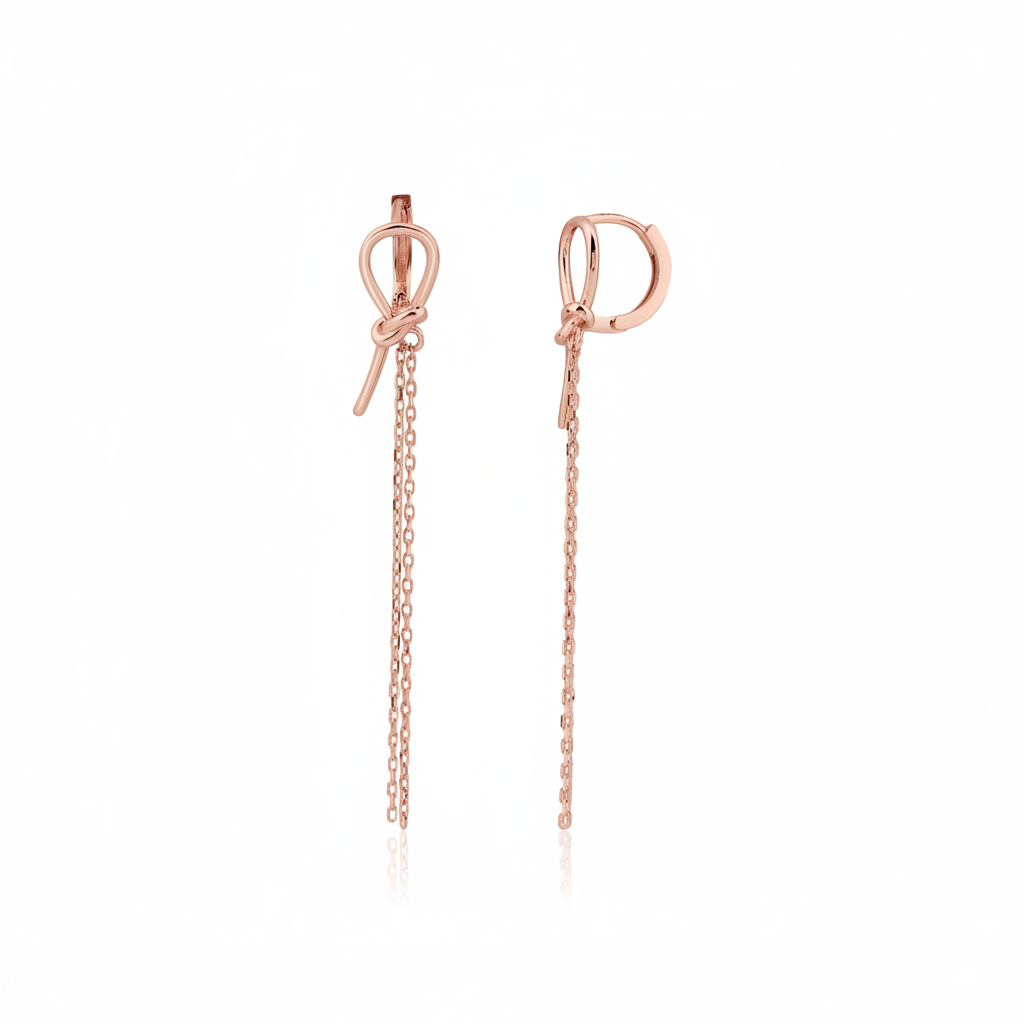 rose gold knot huggie hoop earrings with drop chains on white background