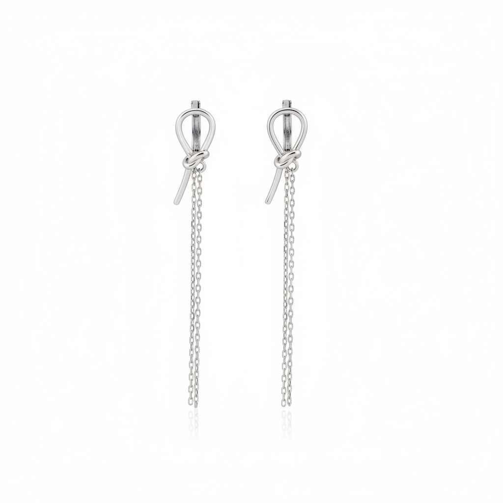 white gold knot huggie hoop earrings with drop chains on white background
