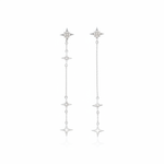 white gold asymmetrical starburst drop earrings on white background