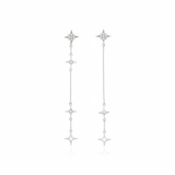 white gold asymmetrical starburst drop earrings on white background