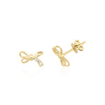 yellow gold bow stud earrings with accent stones on white background