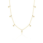 yellow gold chevron drop necklace on white background