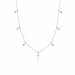 rose gold chevron drop necklace on white background