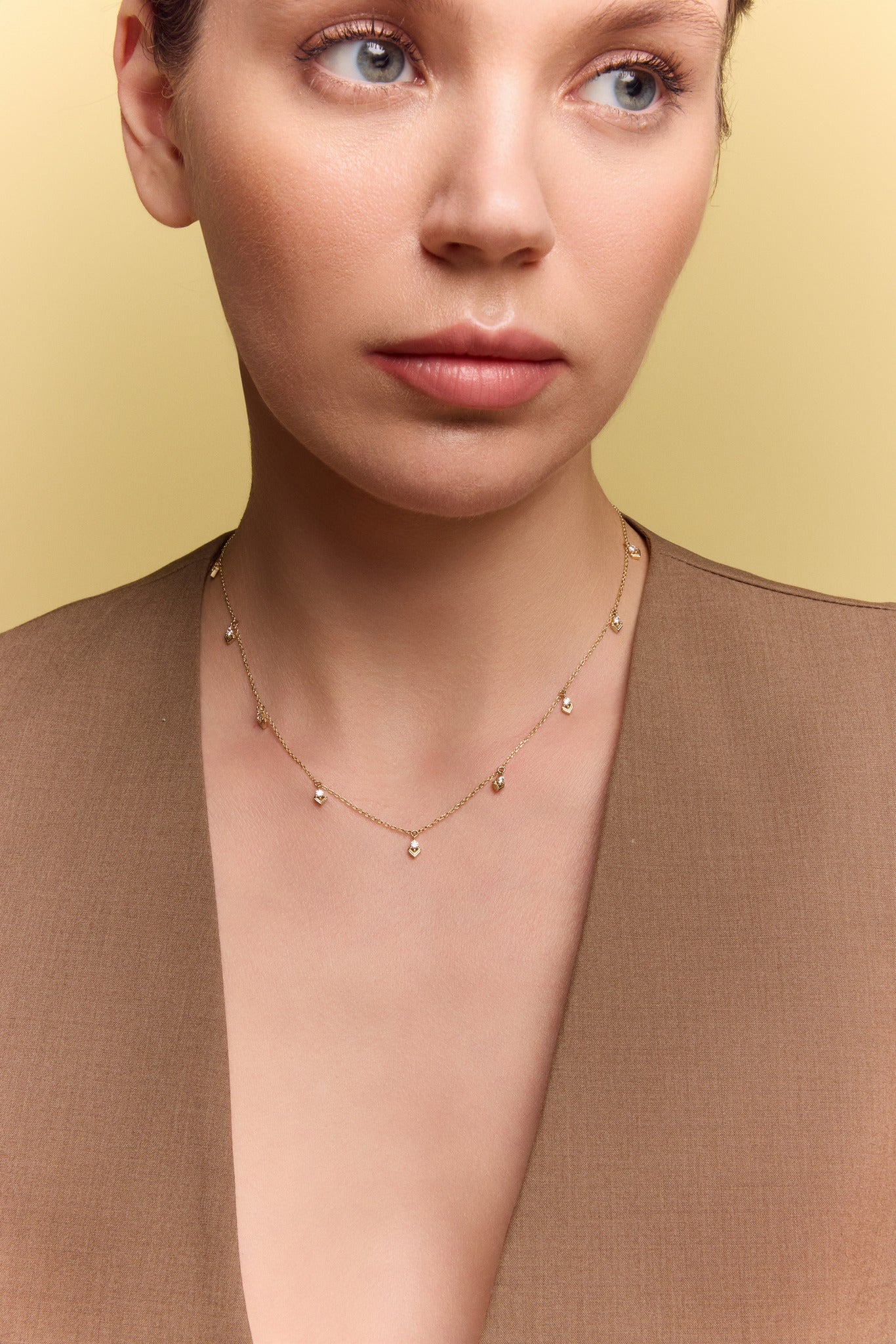 model wearing the gold chevron drop necklace