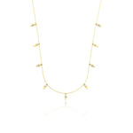 yellow gold triangle charm necklace on white background