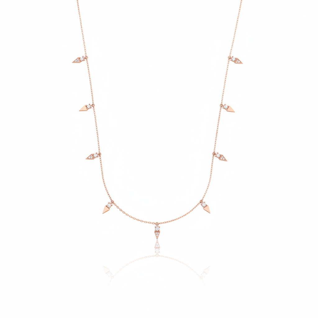 rose gold triangle charm necklace on white background
