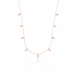 rose gold triangle charm necklace on white background
