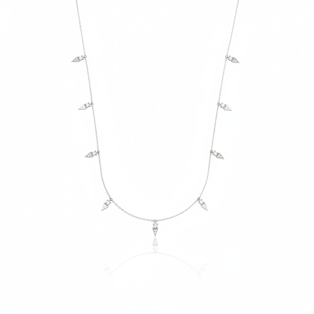 white gold triangle charm necklace on white background