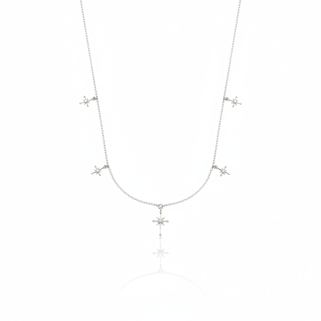 white gold starburst charm necklace with compass star pendant on white background