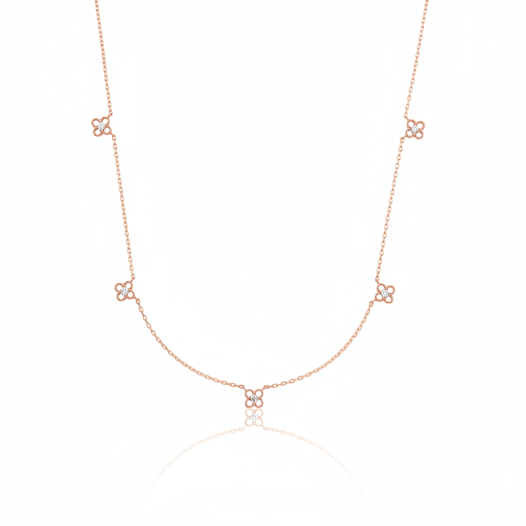 rose gold four-petal flower station necklace on white background