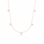 rose gold four-petal flower station necklace on white background