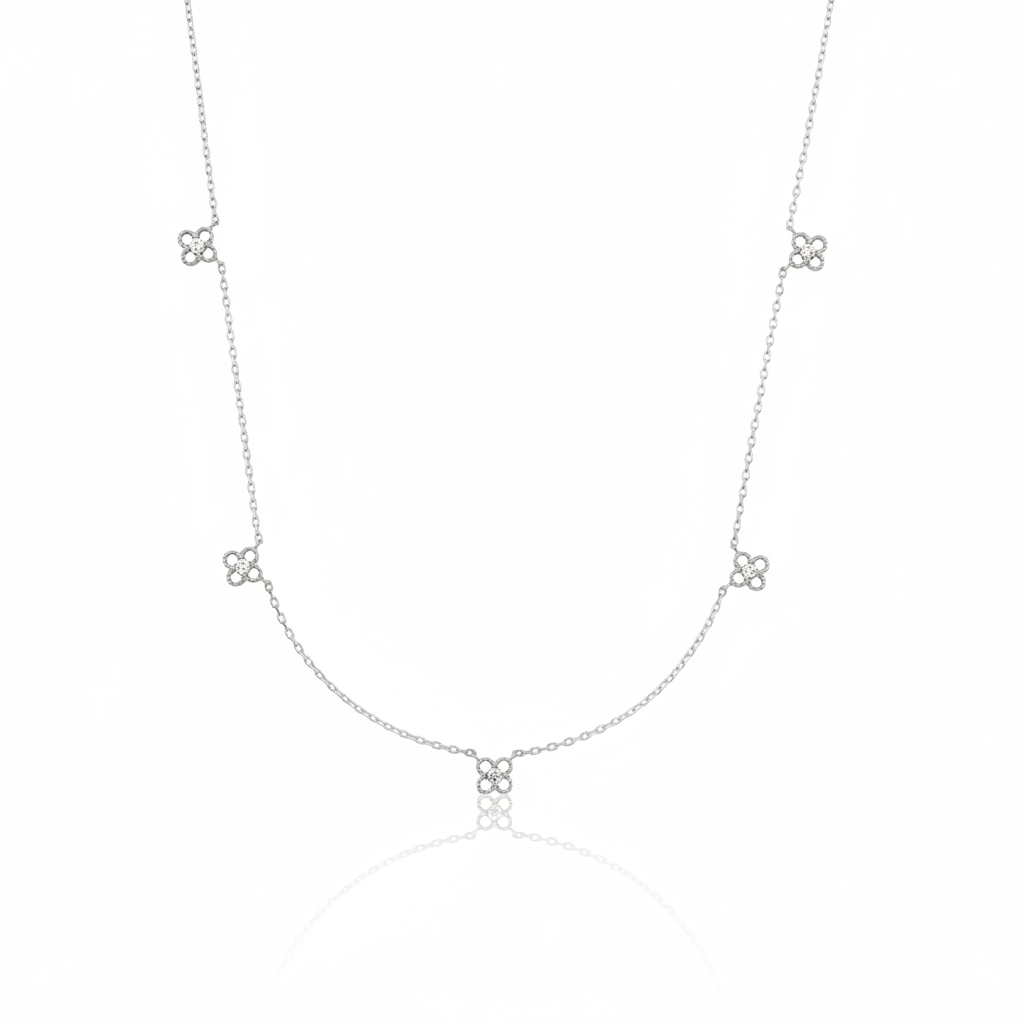 white gold four-petal flower station necklace on white background