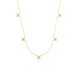 yellow gold floral station necklace on white background