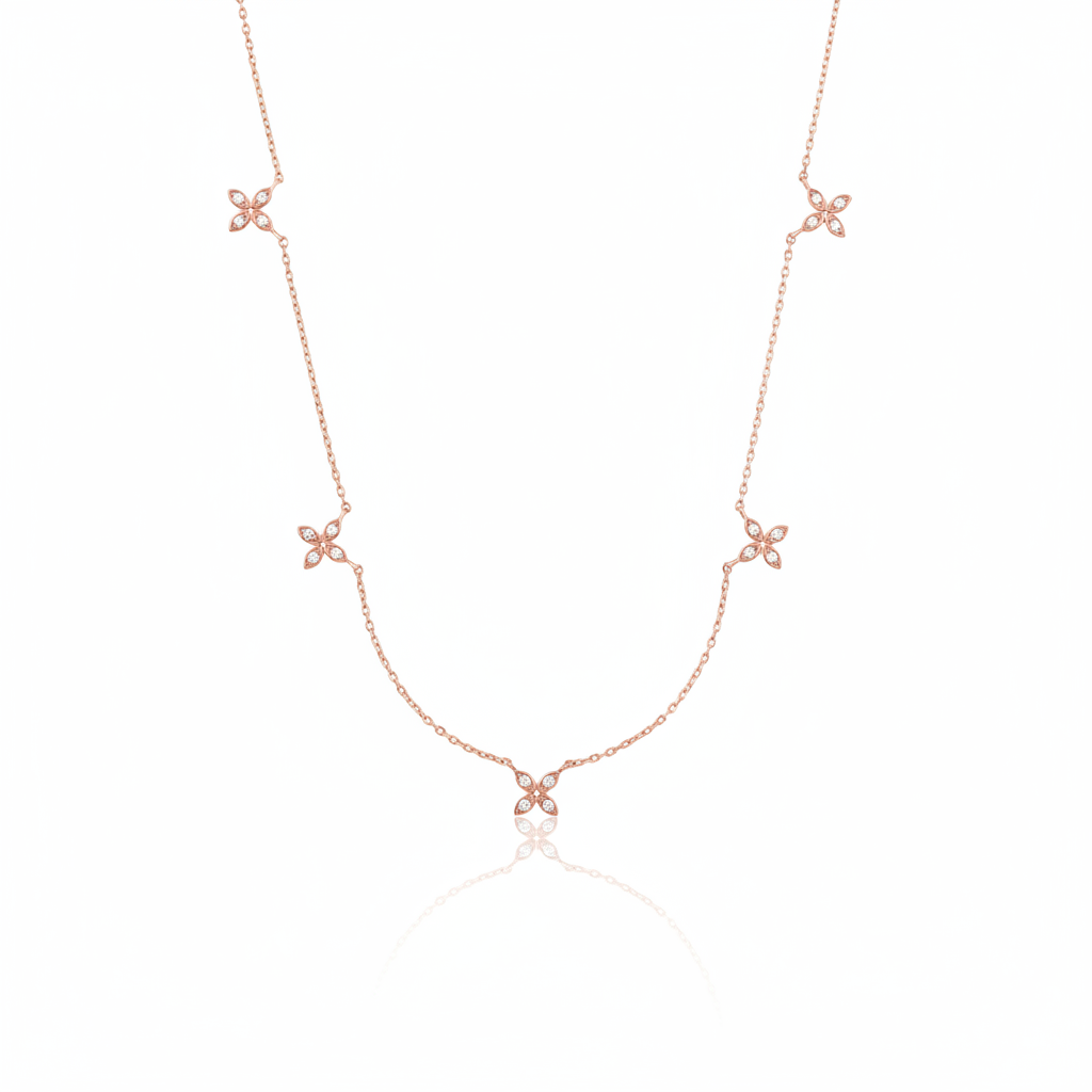 rose gold floral station necklace on white background