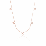 rose gold floral station necklace on white background