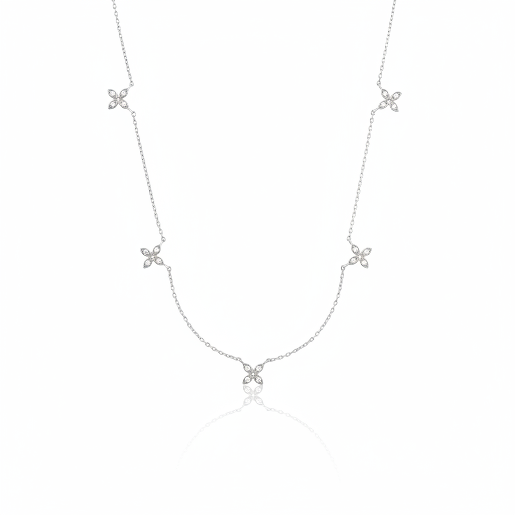 white gold floral station necklace on white background