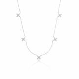 white gold floral station necklace on white background