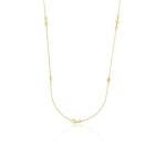 yellow gold scattered stone necklace on white background