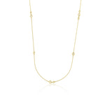 yellow gold scattered stone necklace on white background