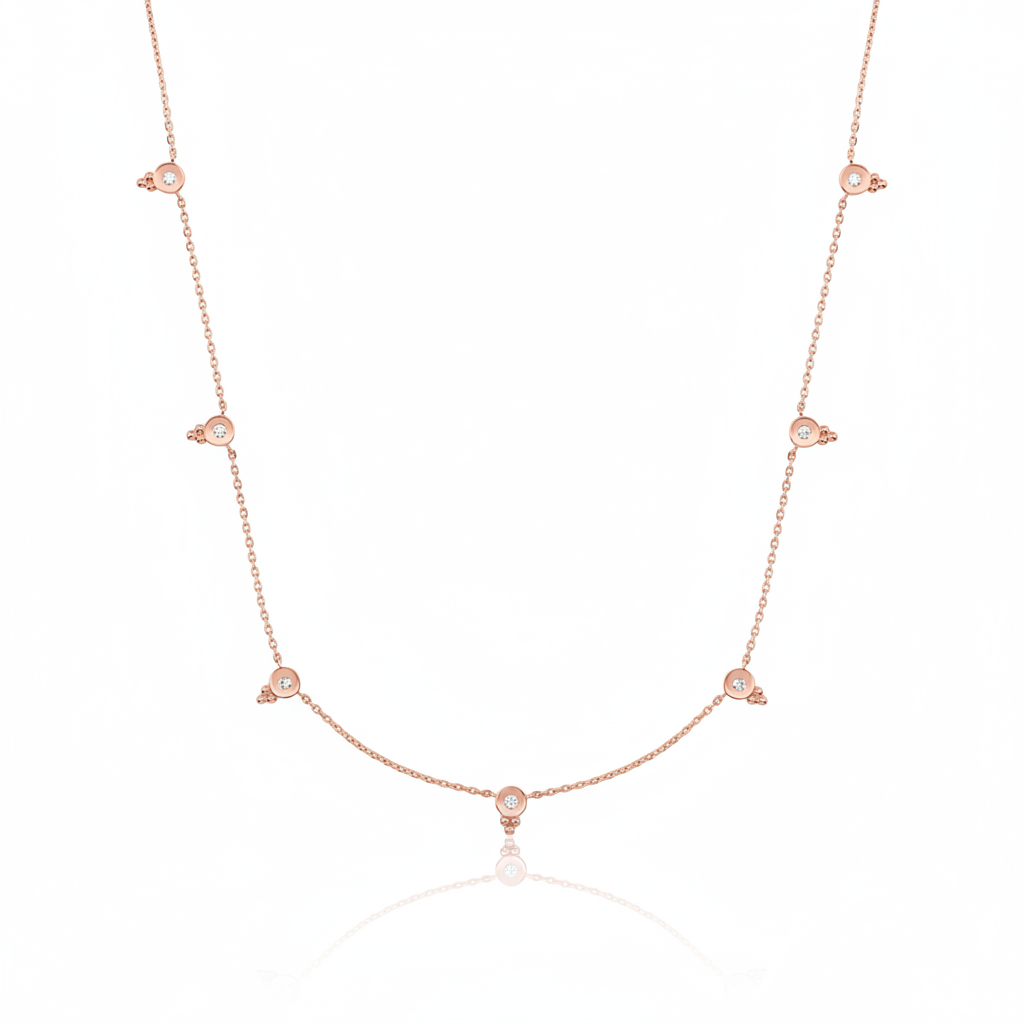 rose gold beaded station necklace on white background