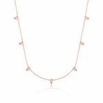 rose gold beaded station necklace on white background