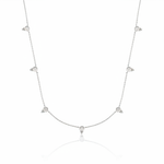 white gold beaded station necklace on white background