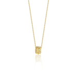 yellow gold barrel pendant necklace on white background