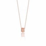rose gold barrel pendant necklace on white background