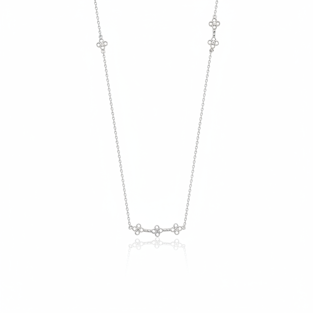 white gold clover station necklace on white background