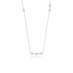 white gold clover station necklace on white background