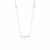white gold clover station necklace on white background