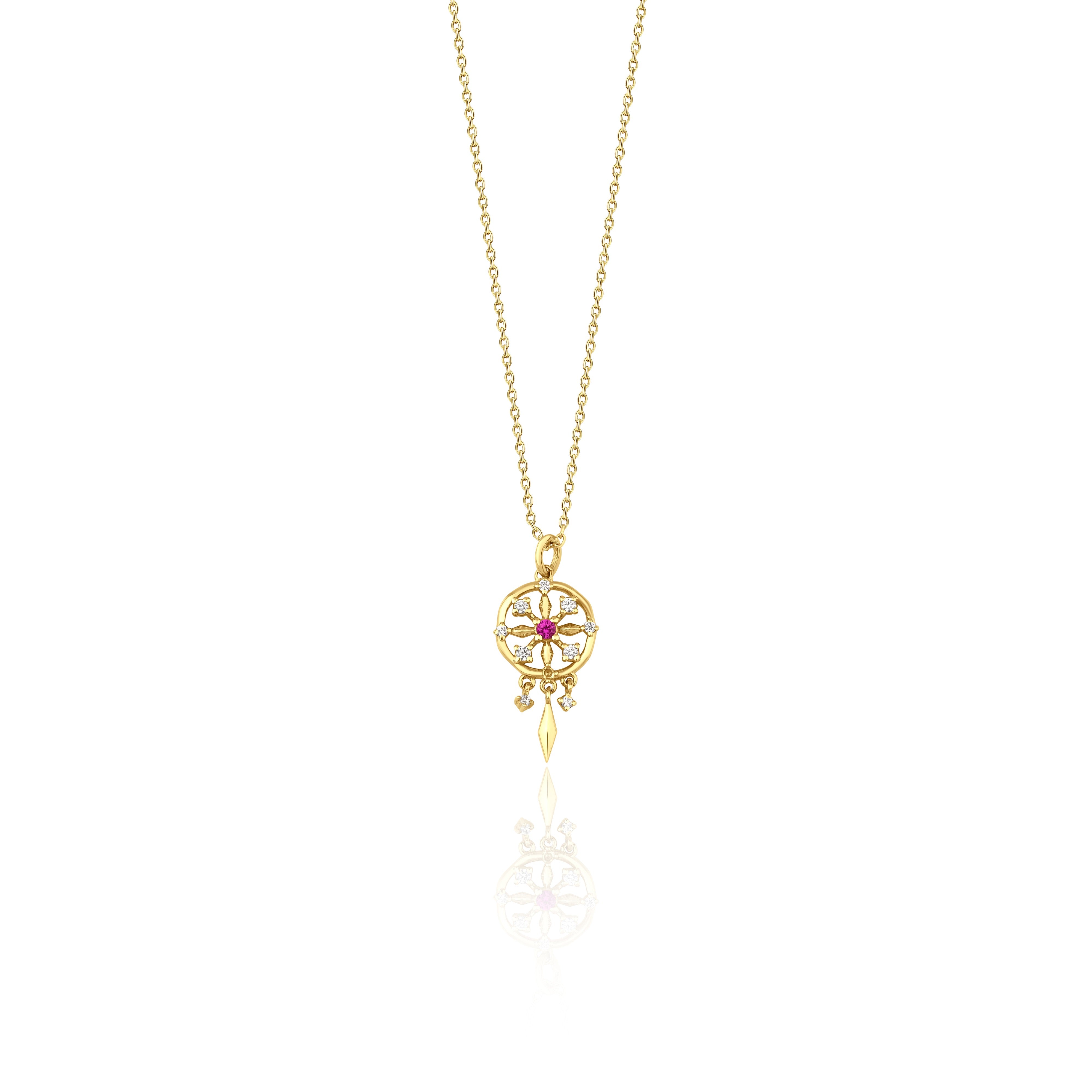 yellow gold talisman wheel necklace on white background