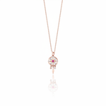 rose gold talisman wheel necklace on white background