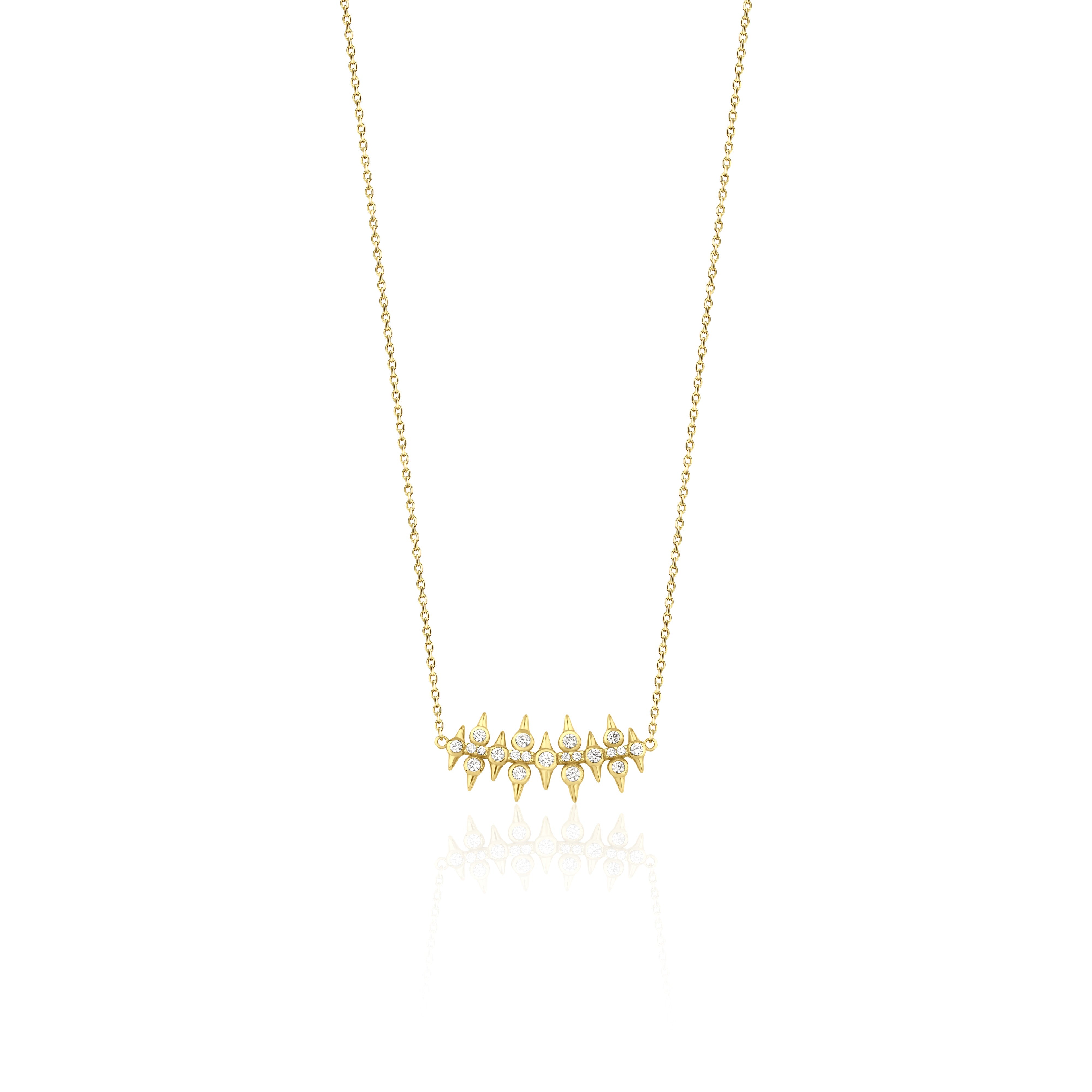 yellow gold spike bar necklace on white background
