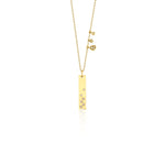 yellow gold bar charm necklace on white background