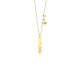 yellow gold bar charm necklace on white background