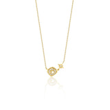 yellow gold starburst pendant necklace on white background