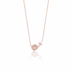 rose gold starburst pendant necklace on white background