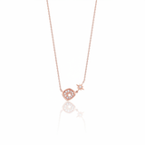 rose gold starburst pendant necklace on white background
