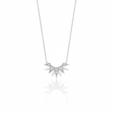 white gold sunburst pendant necklace on white background