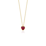 yellow gold red heart pendant necklace on white background