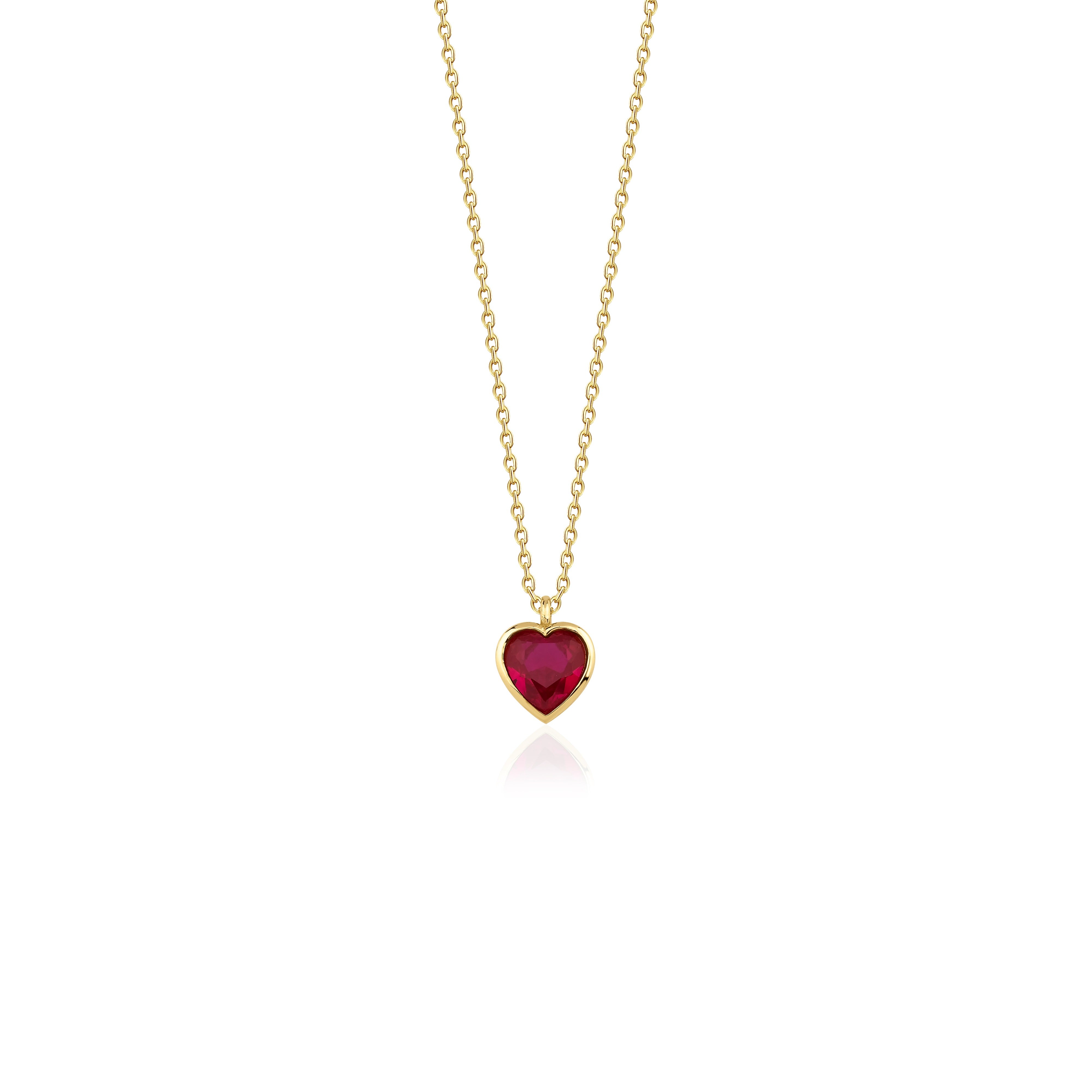 yellow gold red heart pendant necklace on white background