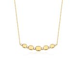 yellow gold cushion station necklace on white background