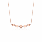 rose gold cushion station necklace on white background
