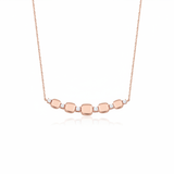 rose gold cushion station necklace on white background