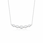 white gold cushion station necklace on white background