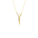 yellow gold dual strand Y-necklace on white background