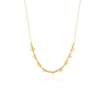 yellow gold arrow bead necklace on white background