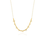 yellow gold arrow bead necklace on white background