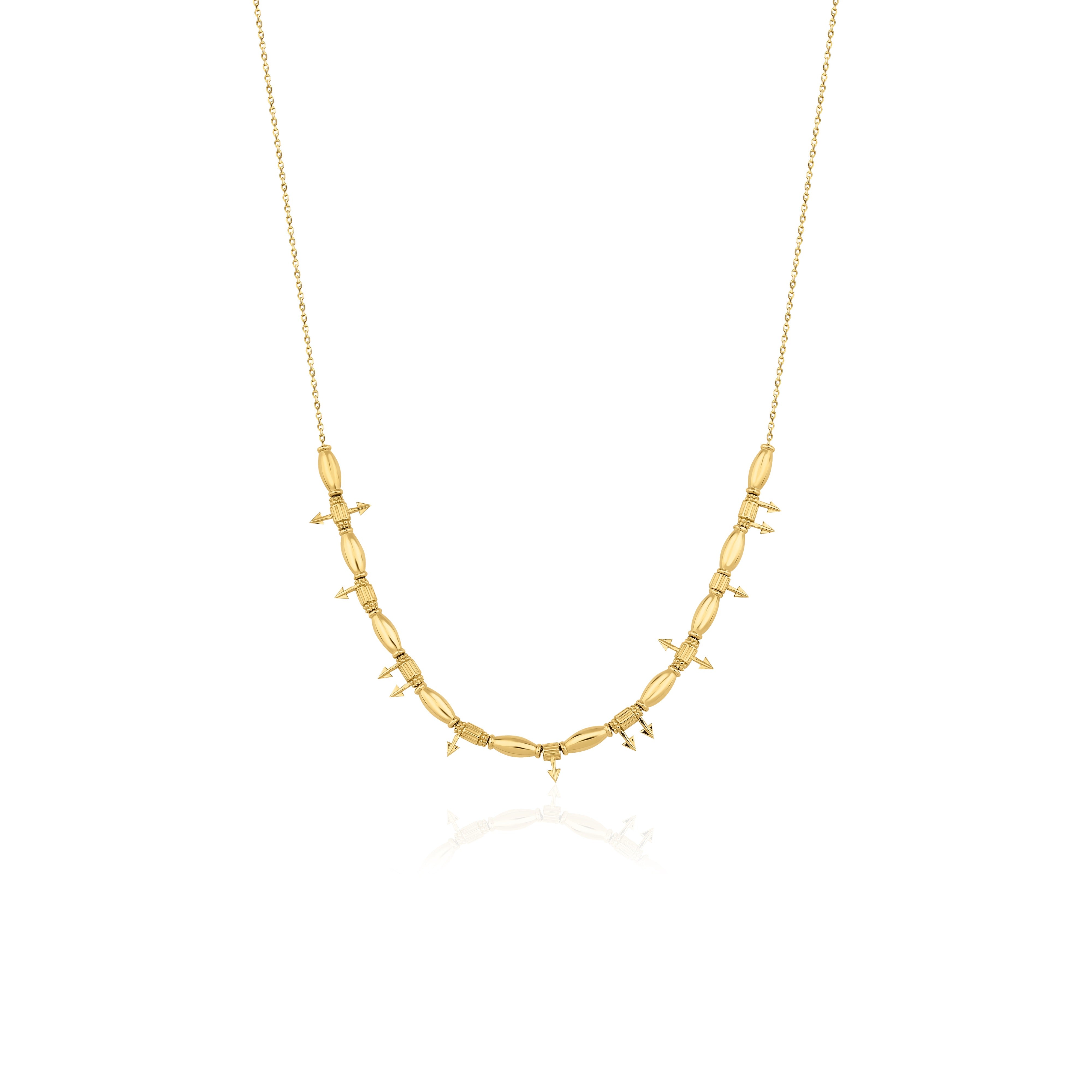 yellow gold arrow bead necklace on white background